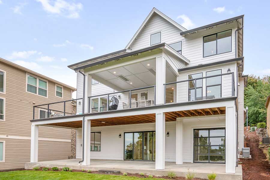 The Lily Custom Home Back Exterior Upper and Lower Decks